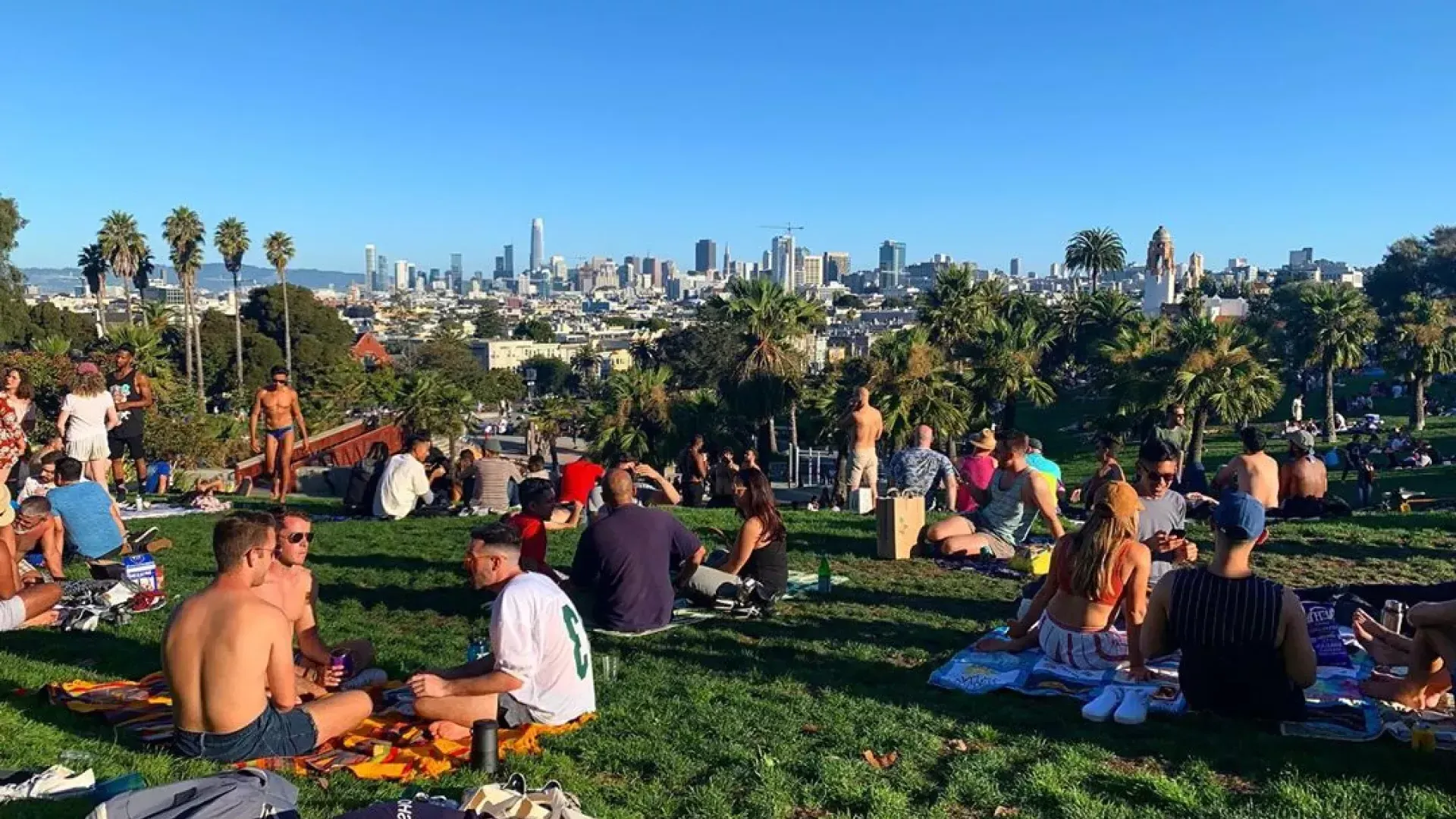 Groups of residents and visitors alike enjoy picnics in Dolores Park.