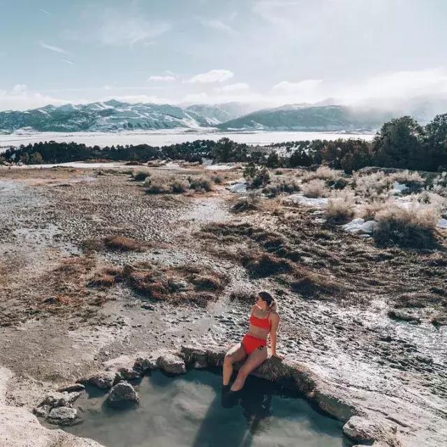 A woman relaxes in a natural hot springs beyond San Francisco.
