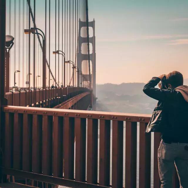 Man taking photos on the Golden Gate Bridge