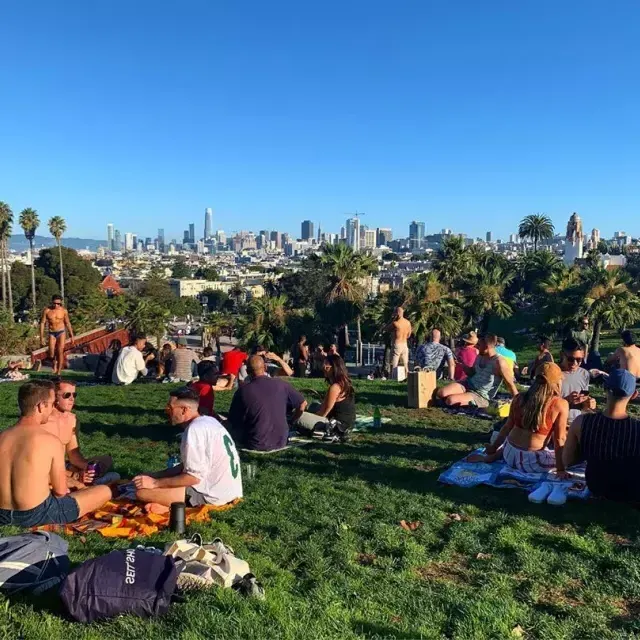 Groups of residents and visitors alike enjoy picnics in Dolores Park.